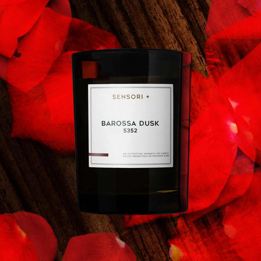 Detoxifying Soy Candle Barossa Dusk with the background of rose petals and sandal wood